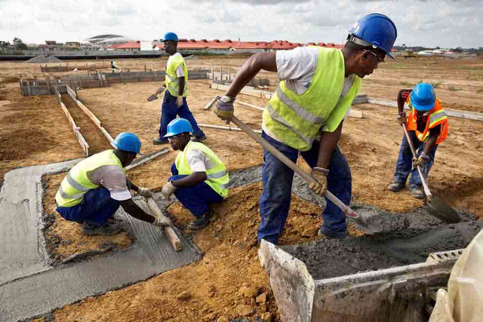 five workers lay cement
