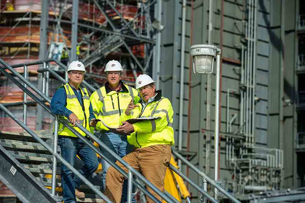 Project workers conduct a field review