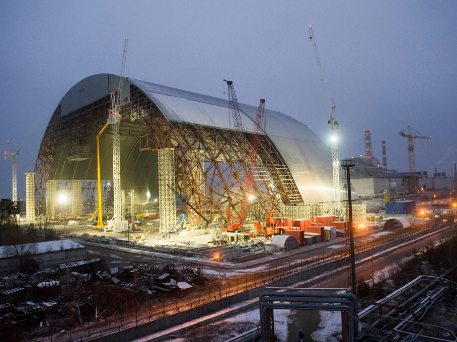 The New Safe Confinement arch was assembled in sections near the damaged reactor and slid into place on rails. Photo: European Bank for Reconstruction and Development
