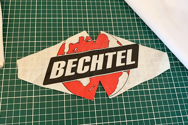 a cut out of the Bechtel logo for a face mask