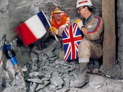 2 tunnel workers with flags