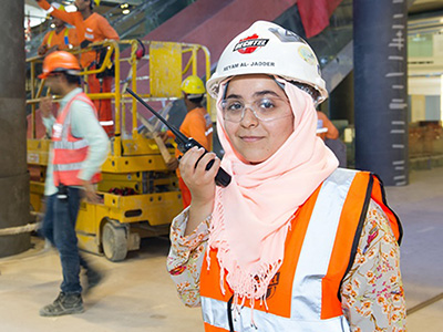 Woman in construction gear on a project site