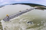 The Bechtel-led joint venture’s work includes about 1.4 miles (2.2 kilometers) of earth-filled dams and 14 miles (23 kilometers) of earthen dikes