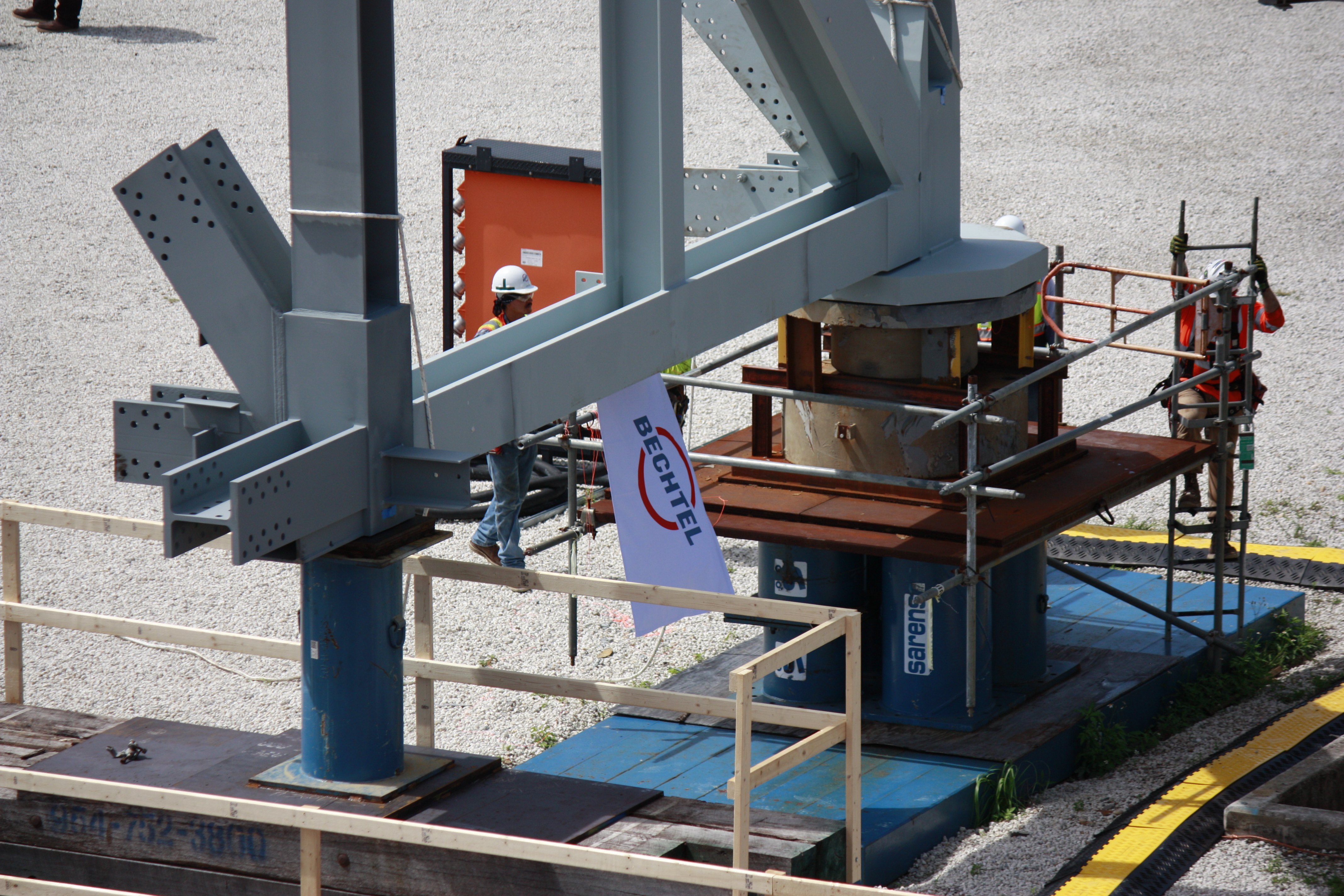 Bechtel flag flies off the first piece of steel erected on the Mobile Launcher 2 base. 