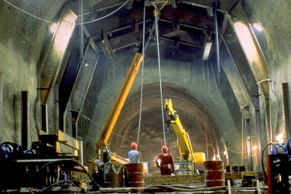 Team members supervise tunneling works