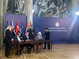 Michael Wilkinson (Bechtel Infrastructure general manager for Europe) and Mehmet Tara (ENKA President and Chairman) and Serbia Deputy Prime Minister and Zorana Mihajlovic finish signing documents