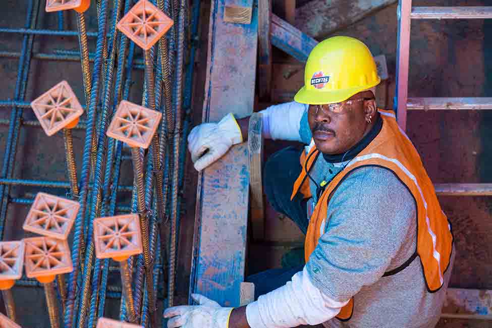 A worker performs rebar installation