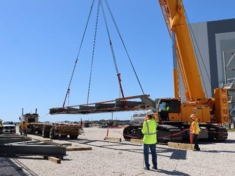 Steel trusses are unloaded by the craft professional team at mobile launcher 2 earlier this month. 