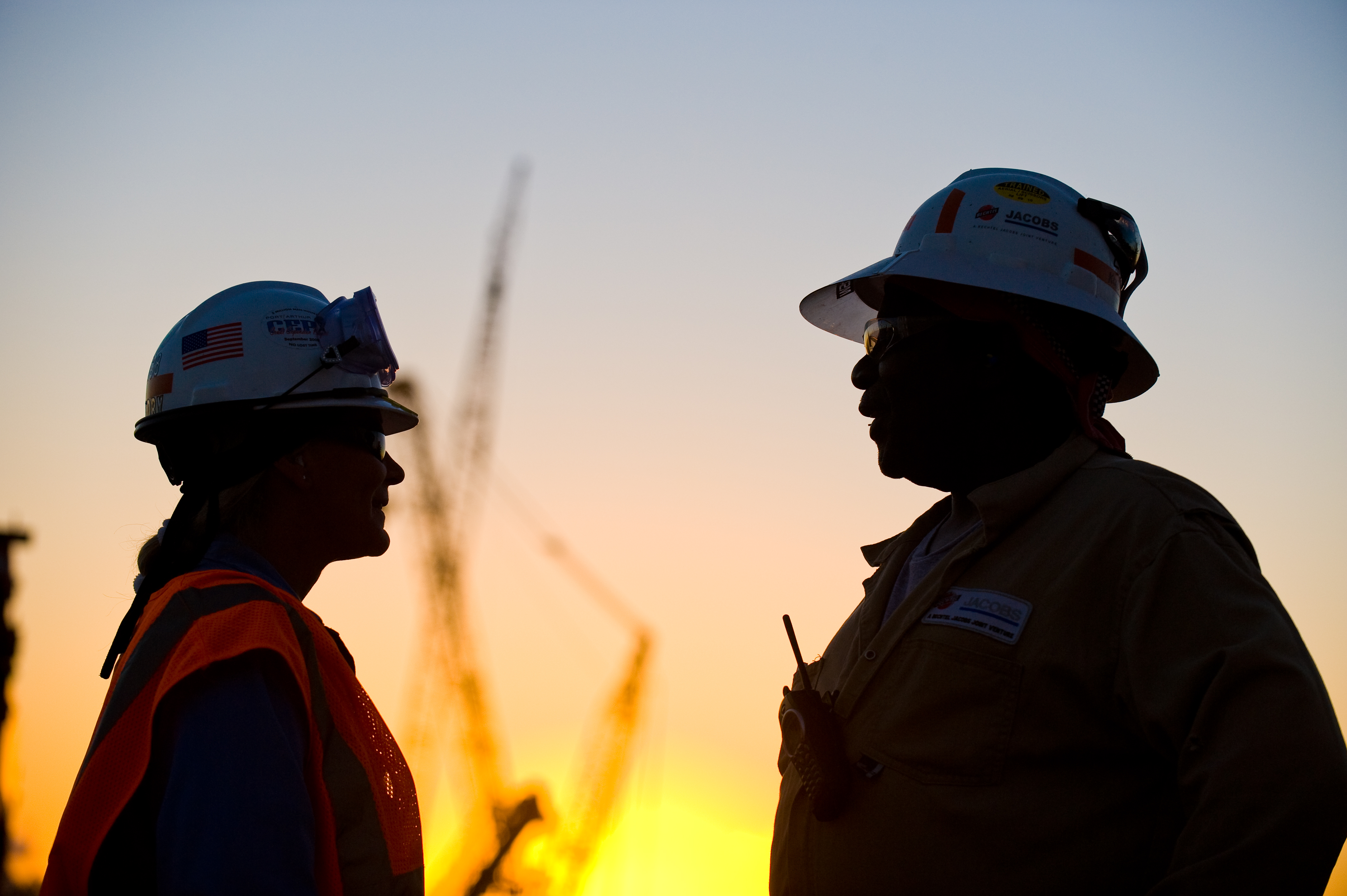 Two workers talking at site