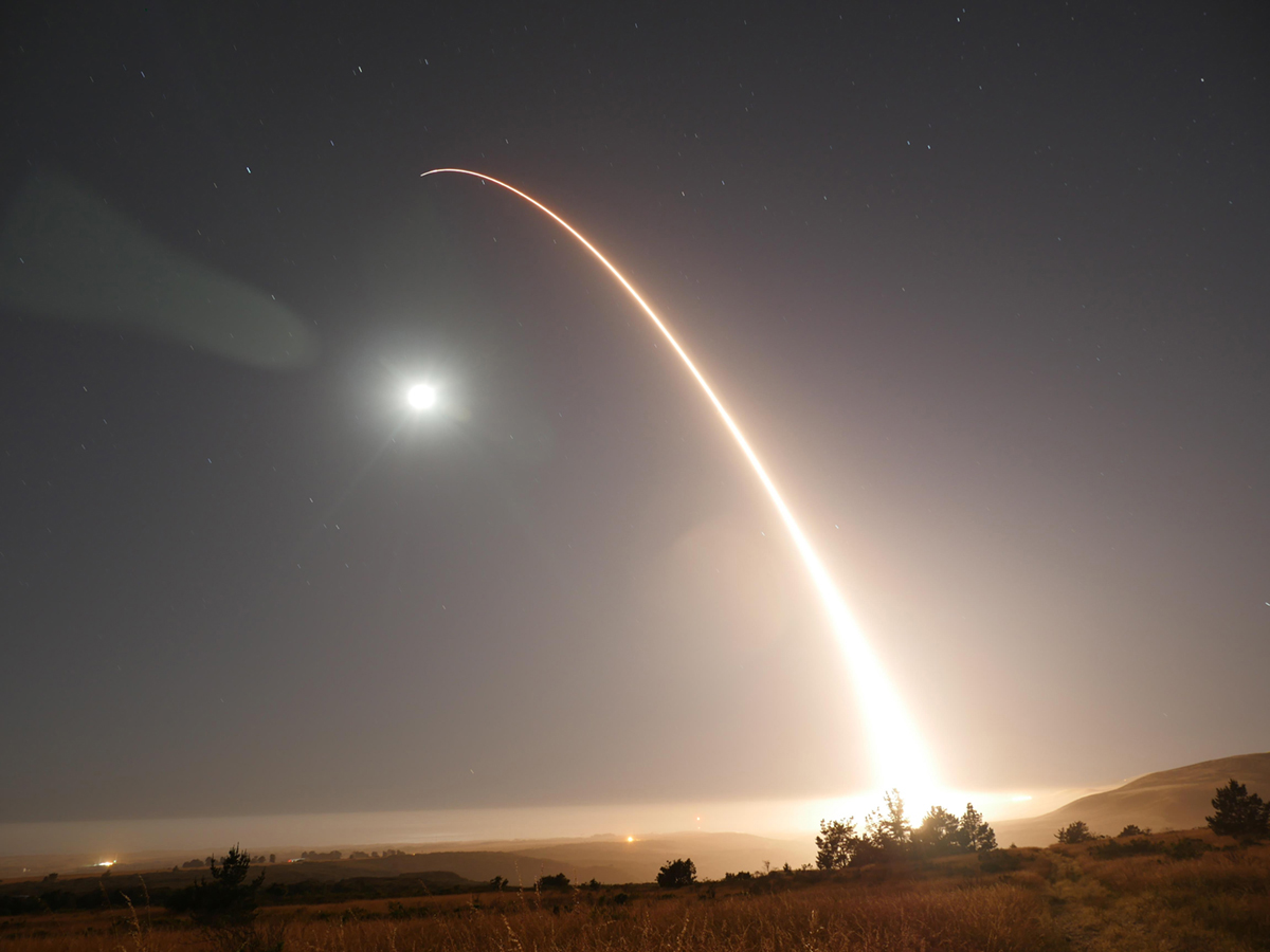 missile launch leaves trail in night sky