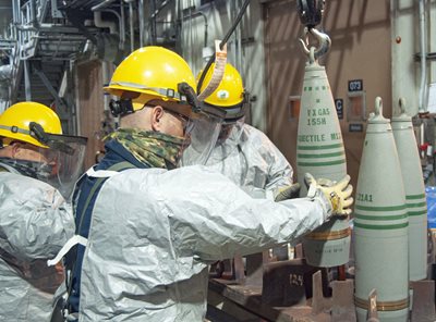 Workers at the Blue Grass Chemical Agent-Destruction Pilot Plant in Kentucky load the last projectiles containing VX nerve agent. 