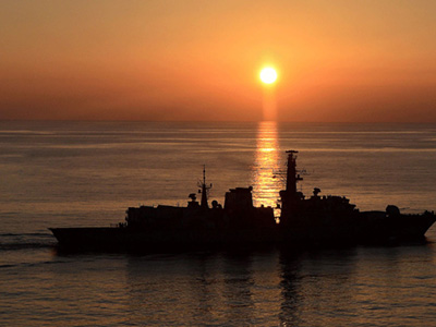 the HMS Montrose at sunset