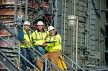 Project workers conduct a field review