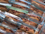 rows of bagged sandwiches in a large box