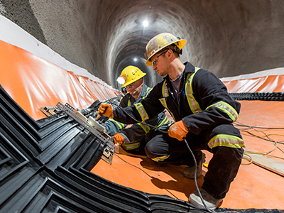 construction workers within tunnel