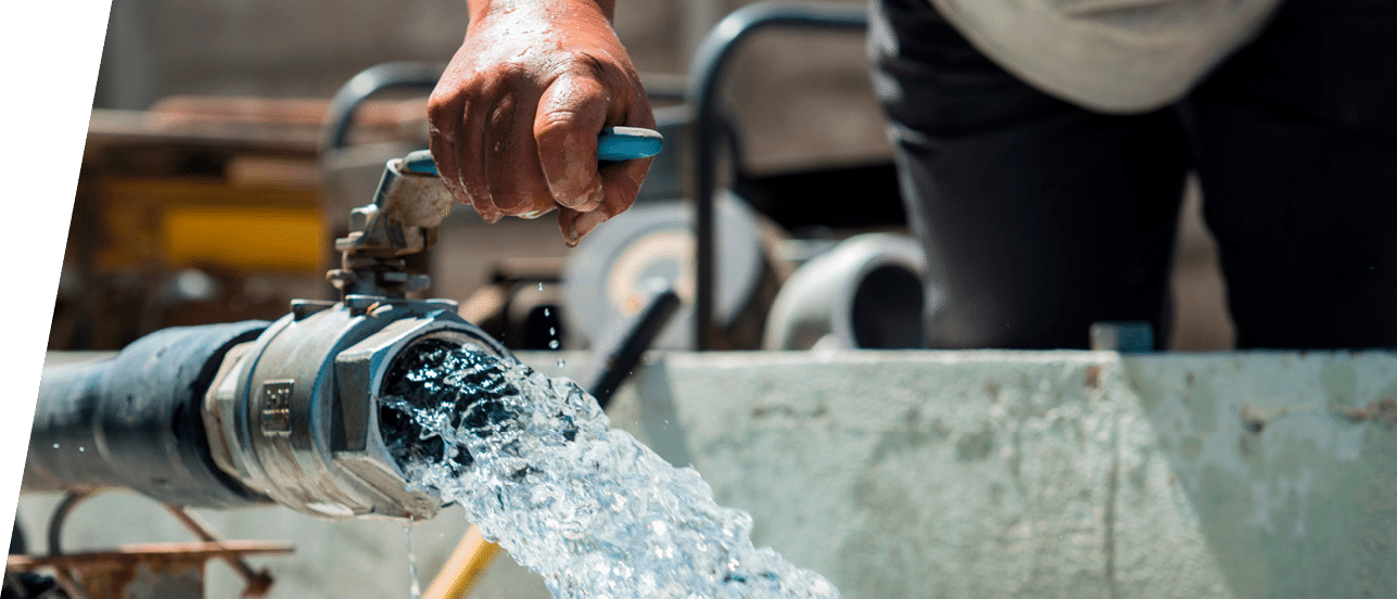A farmer shows the desalinated water used to water sown field at the Atacama desert, in the outskirts of Antofagasta, on February 27, 2019  - In the north of Chile, covered by the most arid desert in the world, water has always been a problem  But now, in Antofagasta, most homes receive desalinated water, making it the largest Latin American city to have drinking water from the sea  And, Atacama desert has the largest hydroponic production in Chile, and the only in Latin America to be supplied with desalinated water  (Photo by Martin BERNETTI   AFP)        (Photo credit should read MARTIN BERNETTI AFP via Getty Images)