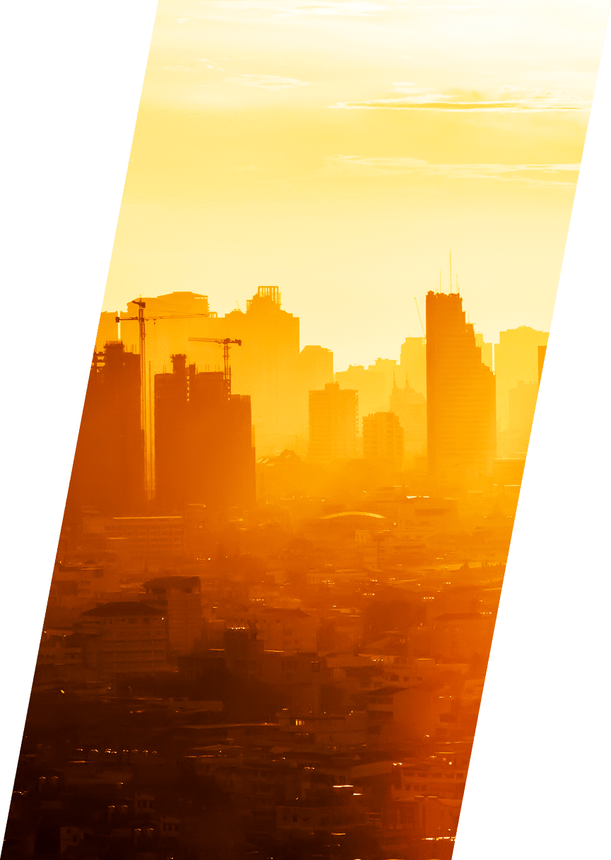 Sunrise over modern office buildings in business district center of Bangkok  Skyline view of cityscape with sunlight and flare in warm light color tone  Construction business concept 