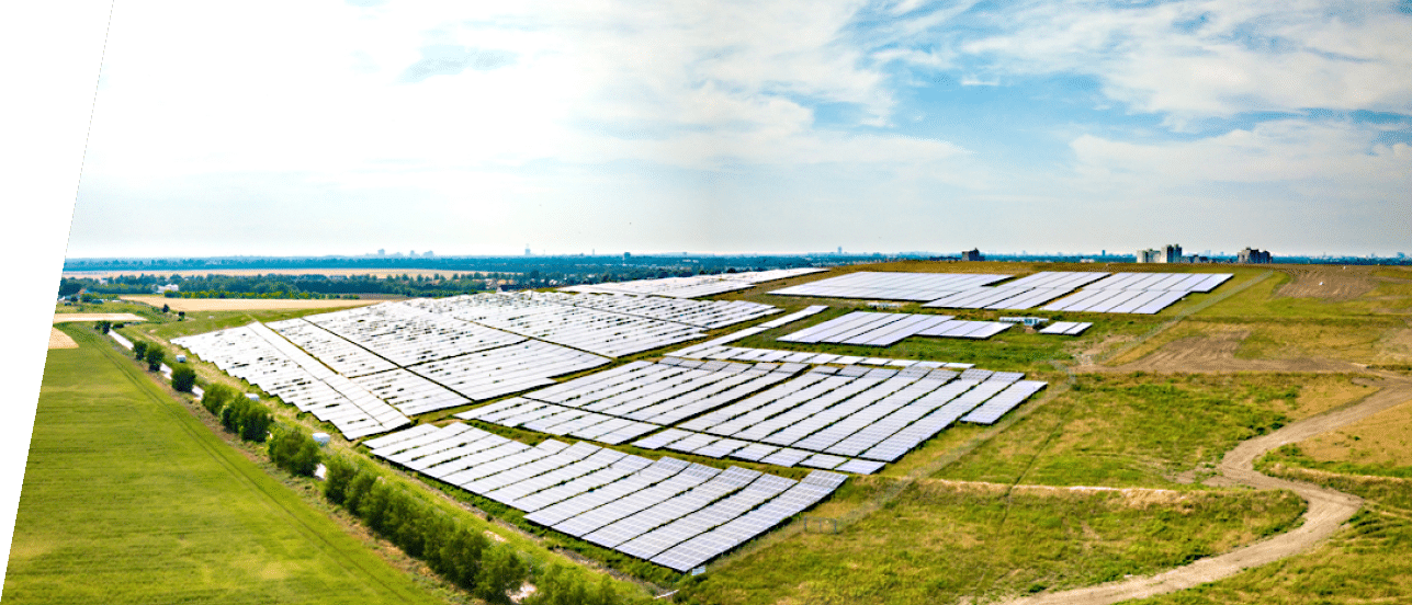 Aerial image of a huge solar farm power station (photovoltaic power station) which produces clean and renewable electricity using solar panels, located on the outskirts of Berlin, Germany  Climate change and global warming are big problems which can be solved with the production of clean electric power from the sun, which is carbon neutral 