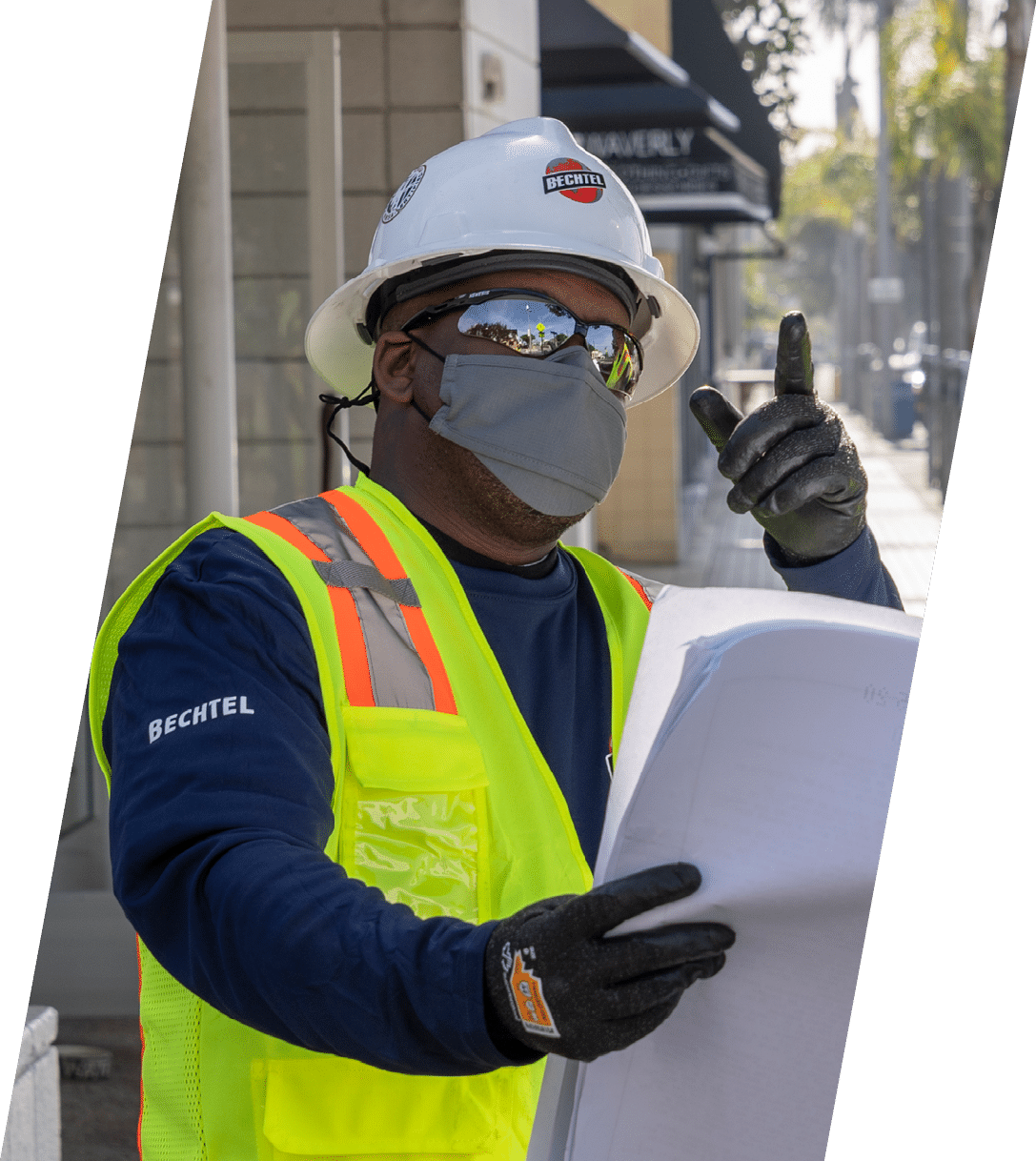 MANHATTAN BEACH, CALIFORNIA - FEBRUARY 11: Bechtel employees look at plans as they perform maintenance work on a cell tower in Manhattan Beach on February 11, 2021 (photo Gilles Mingasson Getty Images for Bechtel)  