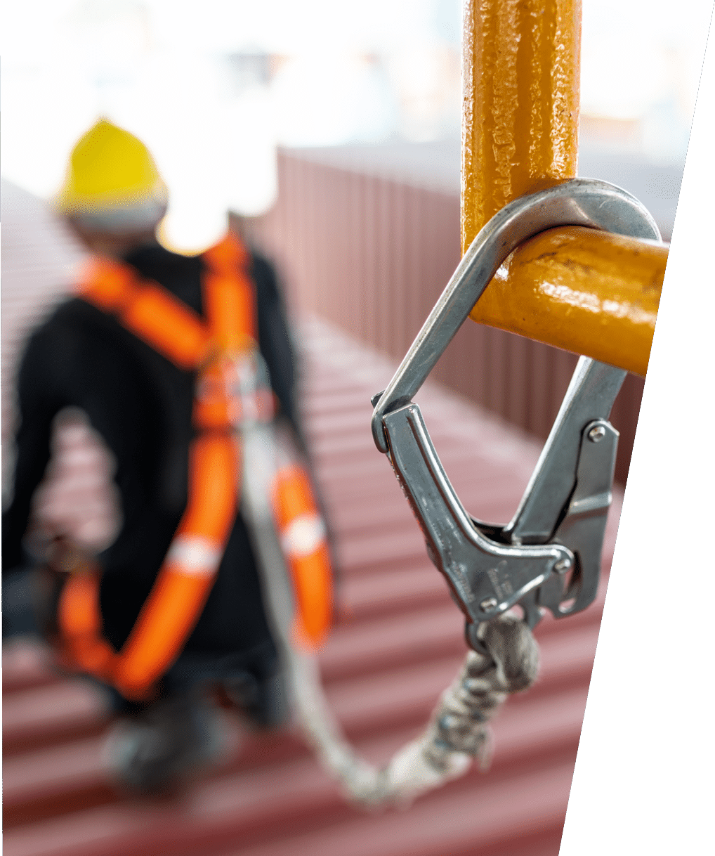 Construction worker wearing safety harness and safety line working at high place 